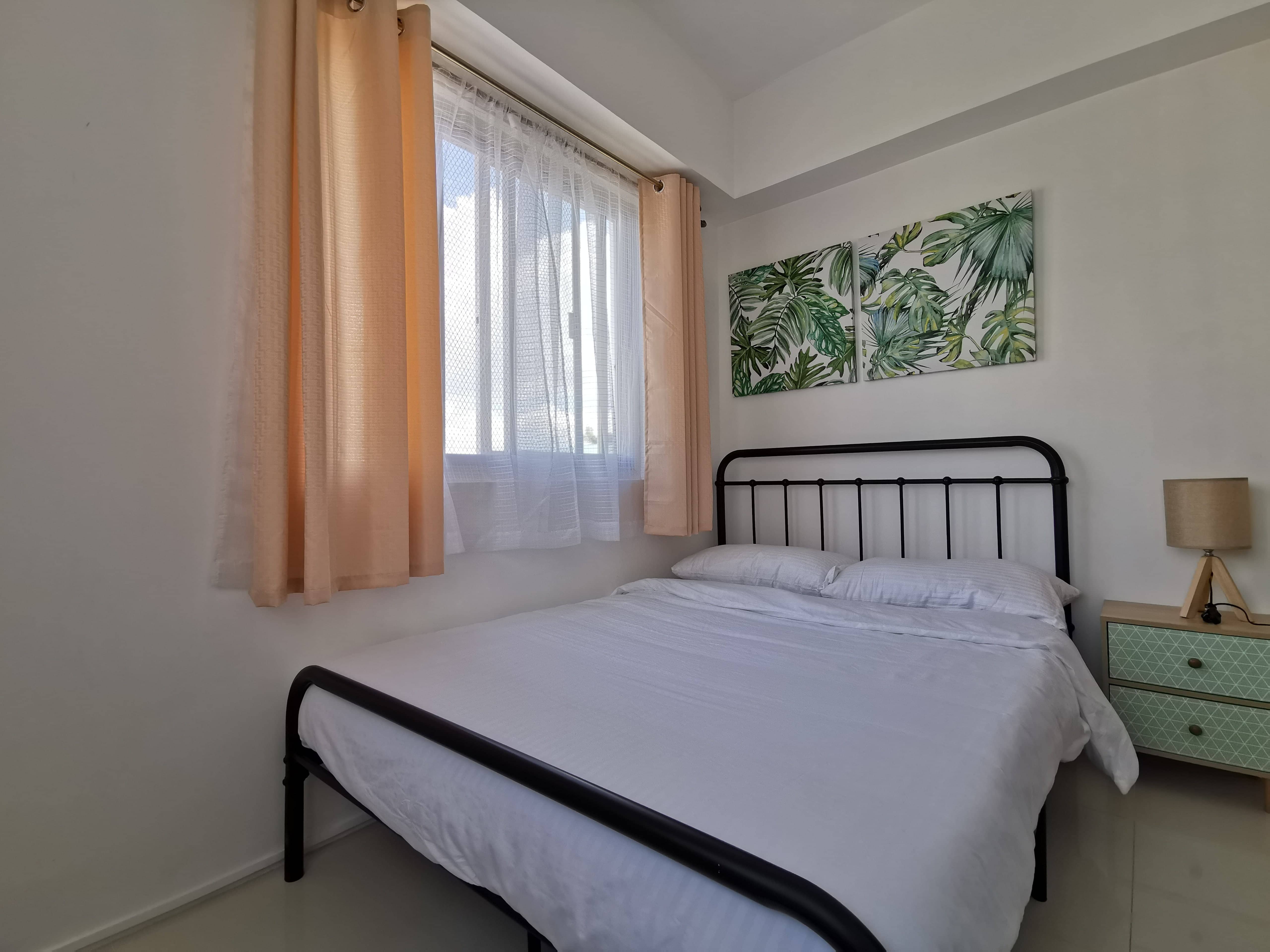 Guest bedroom with wide windows in Burnham Hill Baguio